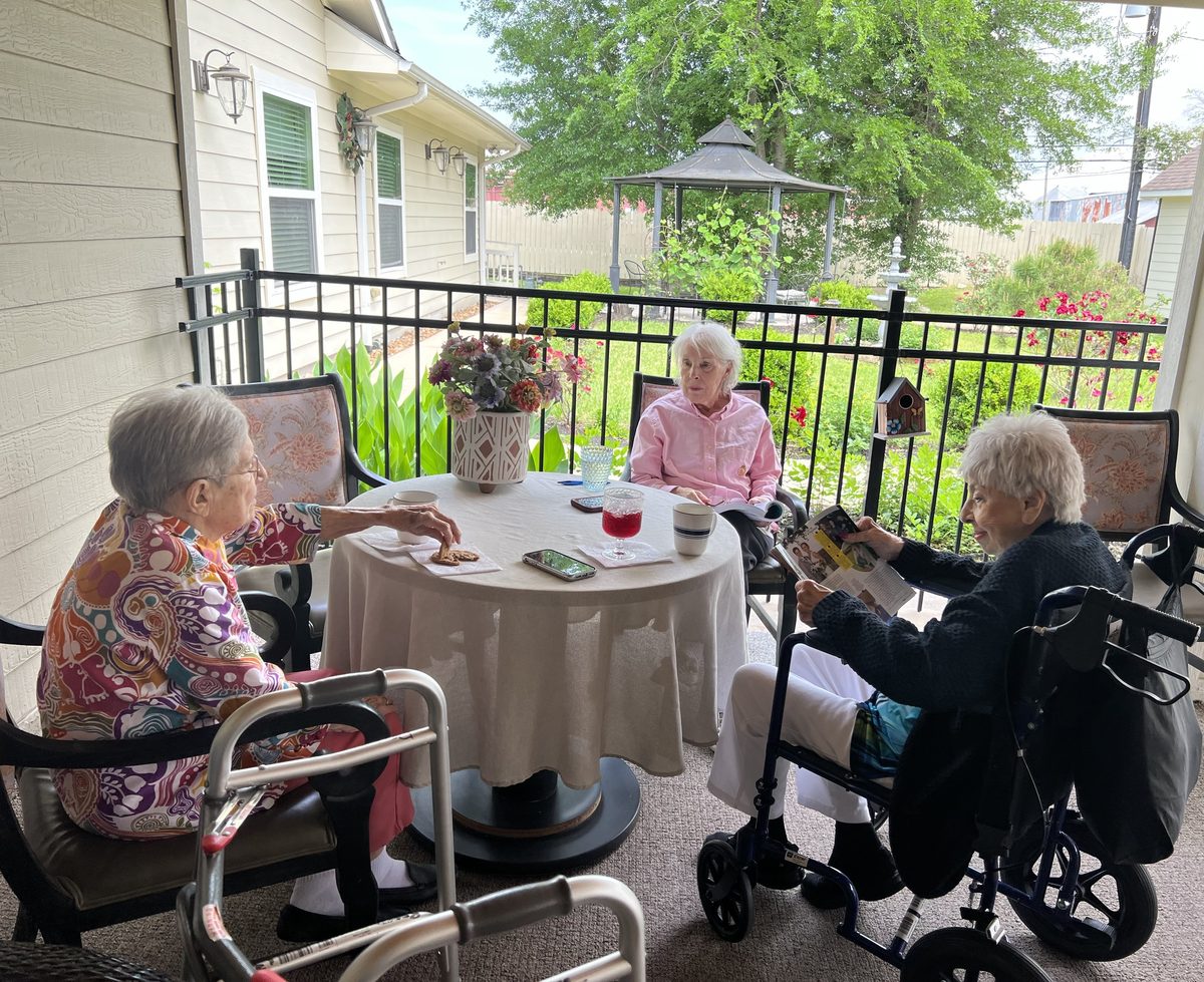 Residents visiting together in a calm, homelike setting